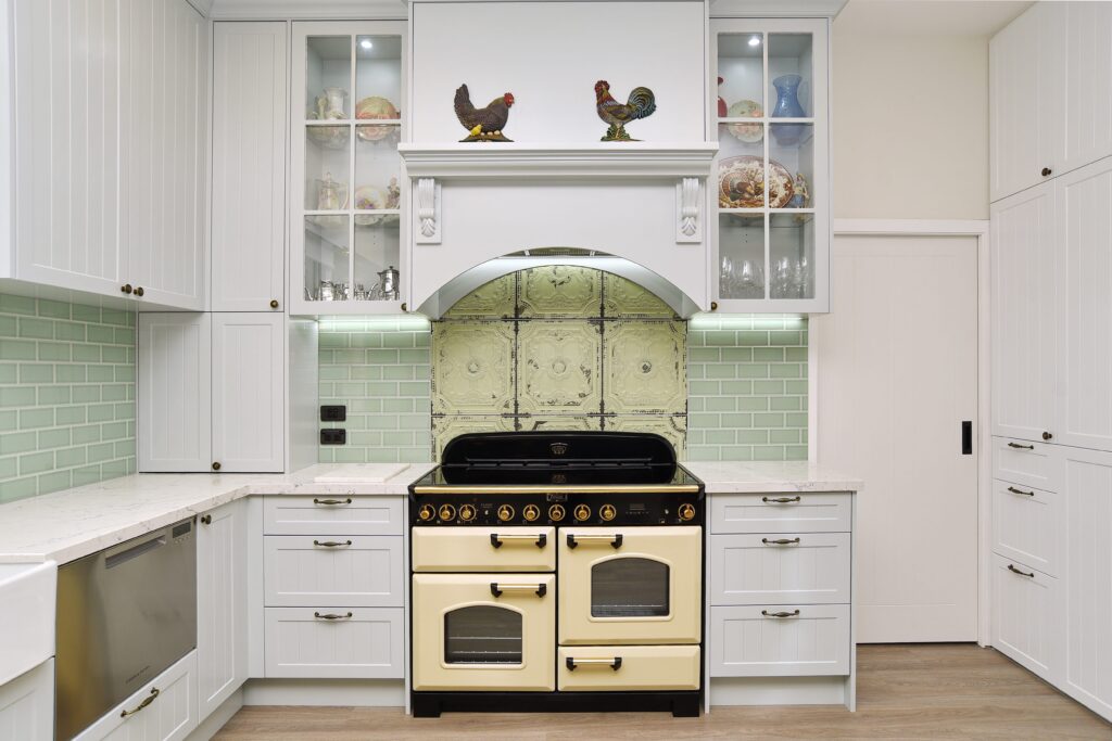 The traditional stove brings character and warmth to the farmhouse kitchen.